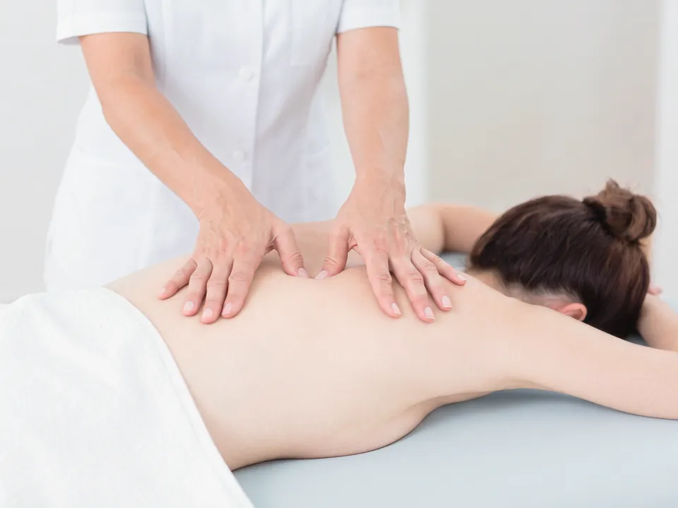 A full-body massage session prepared at home